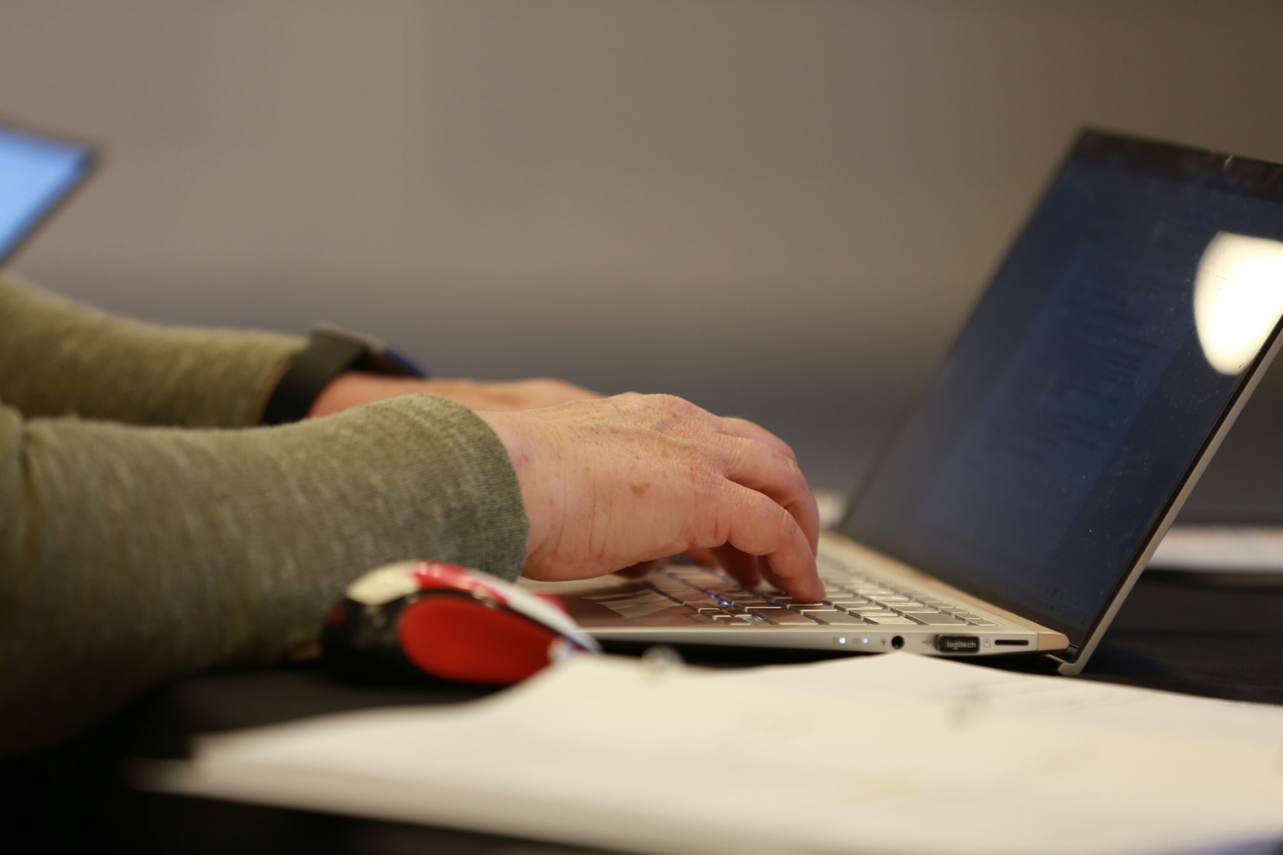 A person typing on a laptop