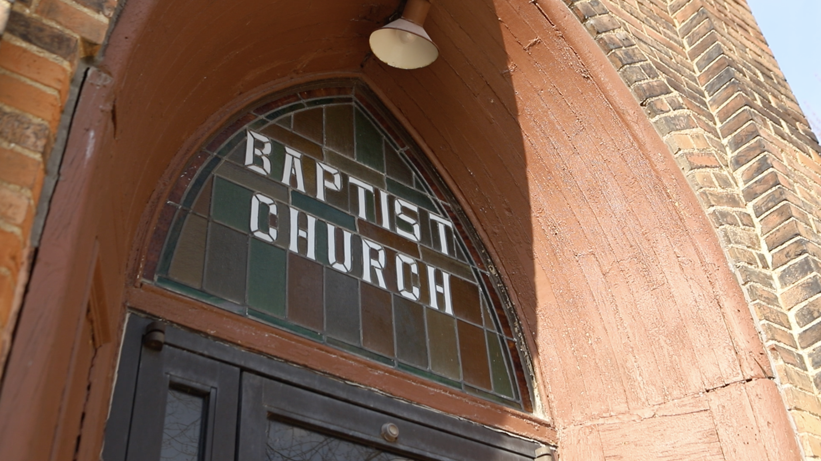 Baptist Church with Stained Glass background